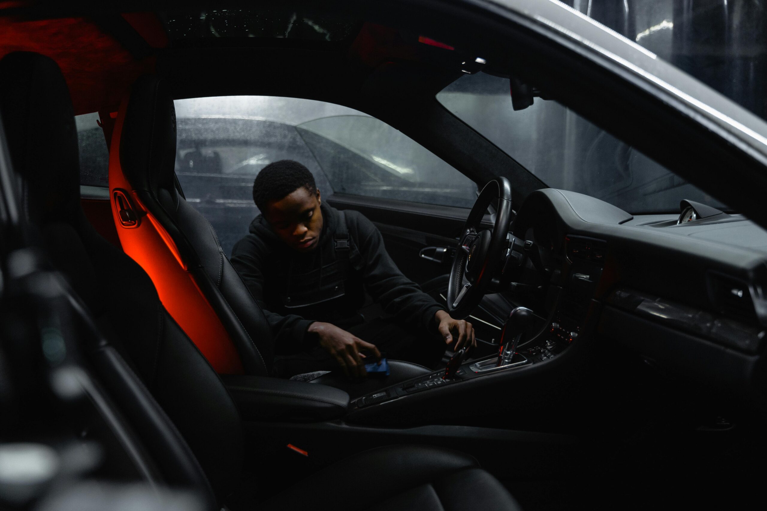 Person cleaning car leather seats