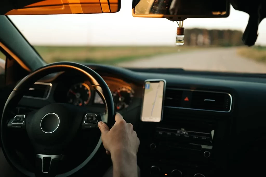 view through a windshield of a car driving on a highway